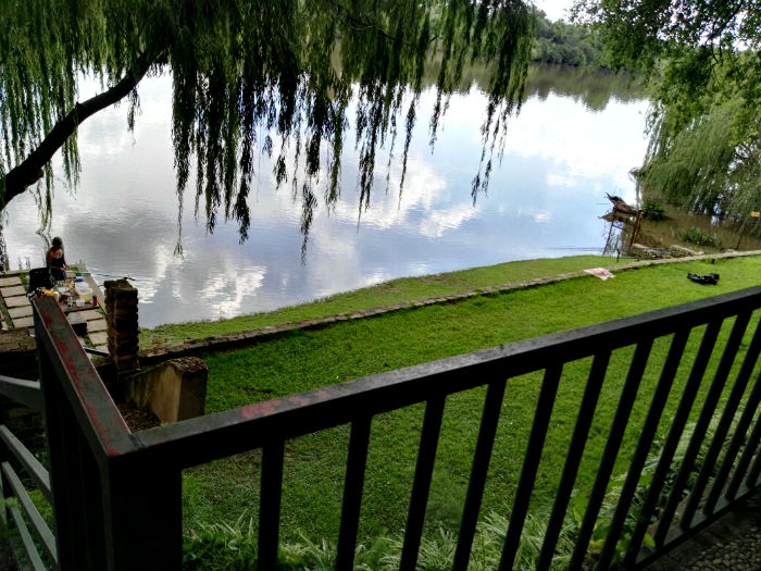 Terraced fishing area at The Riverhouse, viewed from the wooden deck